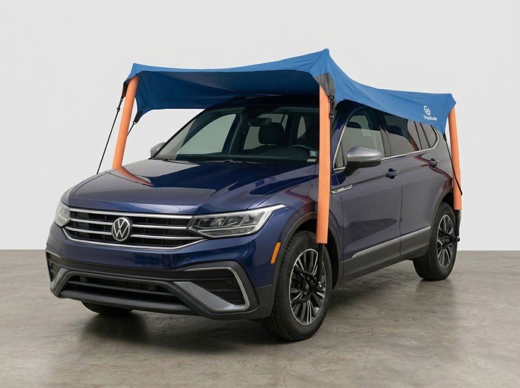 UVgotshade canopy over a navy SUV, studio front view